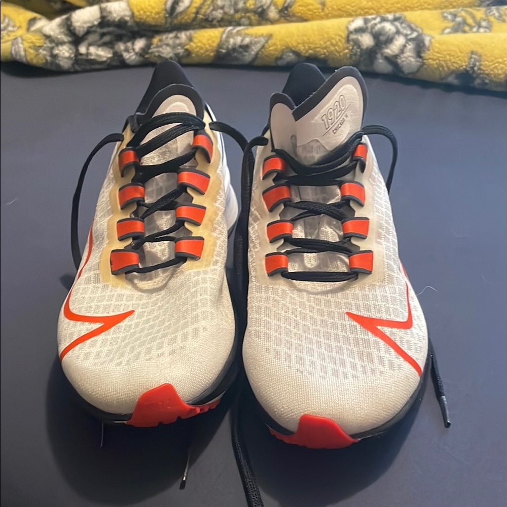 White and Orange Athletic Shoes